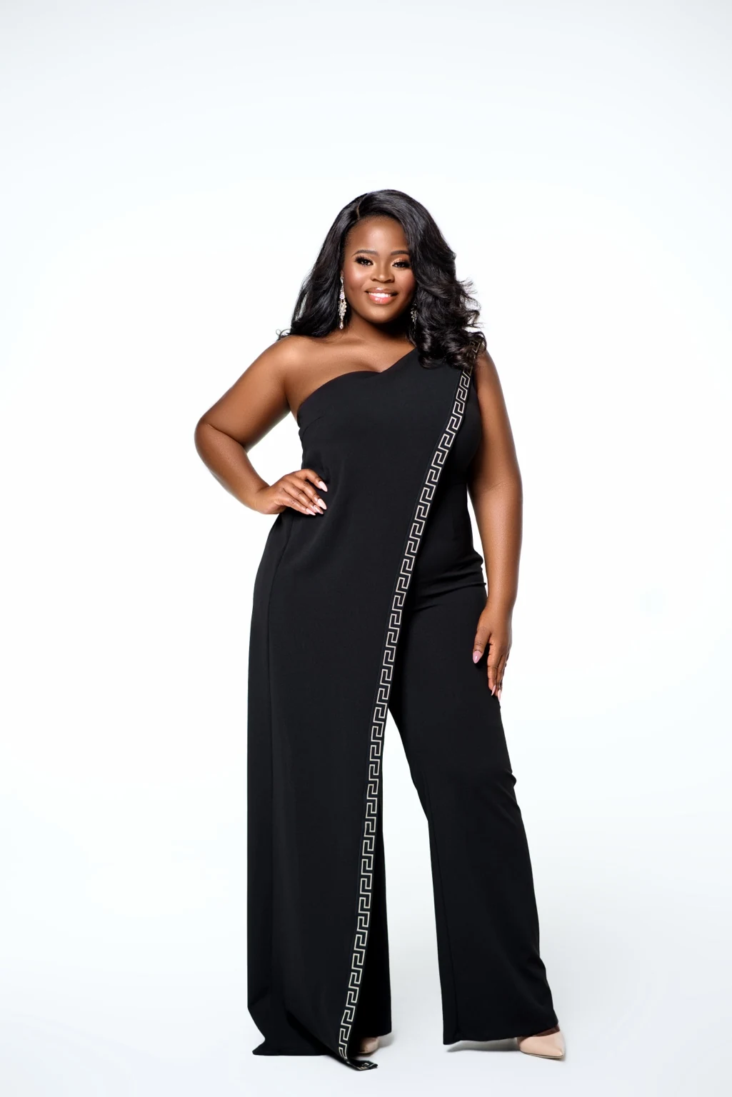 Molina Jeune-Pierre smiling in a black one-shoulder outfit
